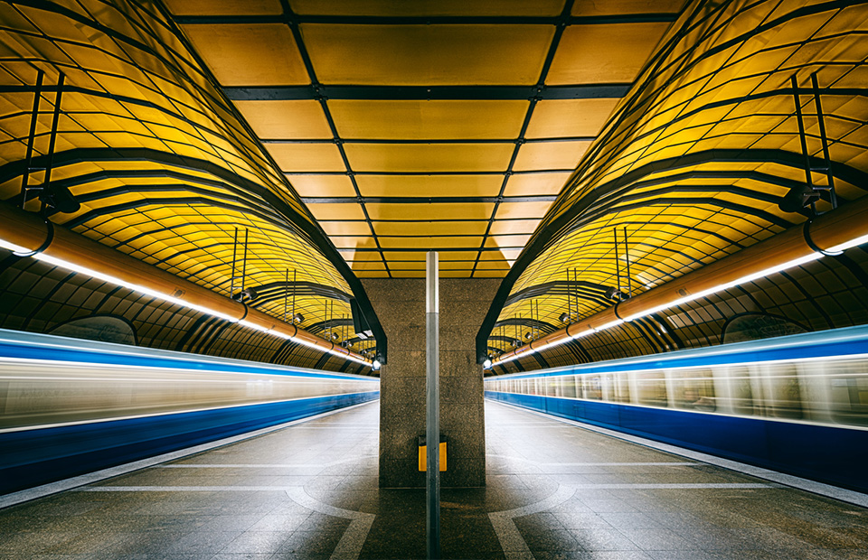 Two trains passing through in subway station