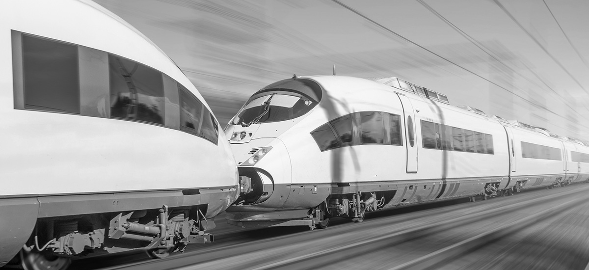 Two moving train carriages against a blurry background